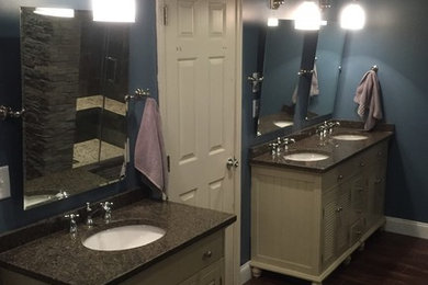 Example of a huge mountain style master medium tone wood floor and brown floor bathroom design in Philadelphia with blue walls, louvered cabinets, white cabinets and an undermount sink