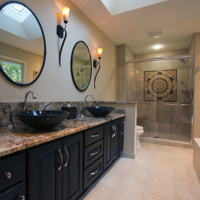 Inspiration for a contemporary bathroom remodel in Milwaukee with a vessel sink and black cabinets