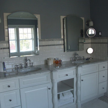 Master Bath Vanity with chrome fixtures and marble counter top.