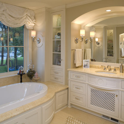Inspiration for a large timeless master beige tile and ceramic tile ceramic tile drop-in bathtub remodel in Minneapolis with beige cabinets and granite countertops