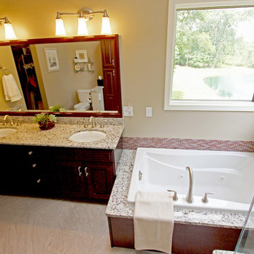 Master Bath with Cherry Cabinetry and Granite Countertops