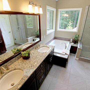 Master Bath with Cherry Cabinetry and Granite Countertops