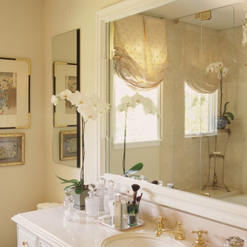 Master bath with Crema Marfil marble and mirrored silk window treatment
