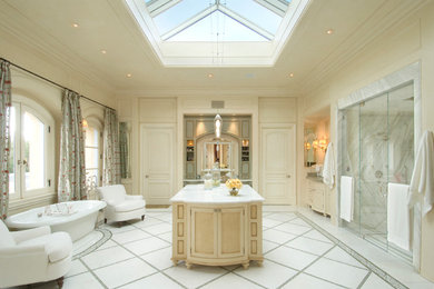 Inspiration for a huge timeless master marble floor bathroom remodel in San Francisco with an undermount sink, furniture-like cabinets, beige cabinets, marble countertops and beige walls