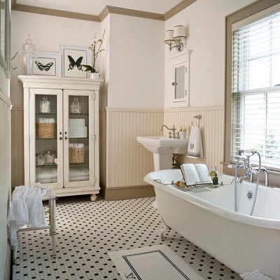 Inspiration for a timeless claw-foot bathtub remodel in Other with a pedestal sink