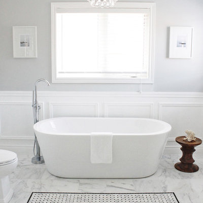 Freestanding bathtub - contemporary white tile freestanding bathtub idea in Toronto