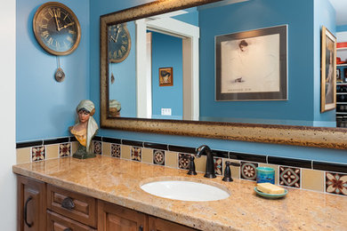 Example of a mid-sized classic master yellow tile and ceramic tile porcelain tile alcove shower design in Portland with furniture-like cabinets, medium tone wood cabinets, a two-piece toilet, blue walls, an undermount sink and granite countertops