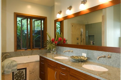 Foto de cuarto de baño tropical con encimera de acrílico y lavabo bajoencimera