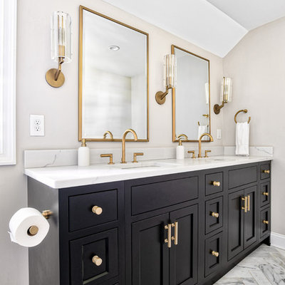 Example of a large transitional master marble tile marble floor and white floor alcove shower design in New York with beaded inset cabinets, black cabinets, an undermount sink, quartz countertops, a hinged shower door and white countertops
