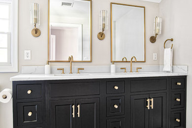 Inspiration for a large transitional master marble tile marble floor and white floor alcove shower remodel in New York with black cabinets, an undermount sink, quartz countertops, a hinged shower door, white countertops and shaker cabinets