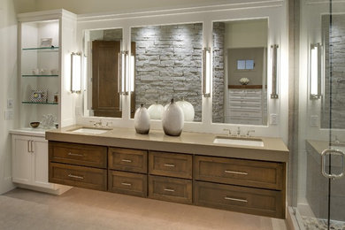 Inspiration for a large transitional master travertine floor and beige floor wet room remodel in Minneapolis with shaker cabinets, medium tone wood cabinets, beige walls, an undermount sink and a hinged shower door