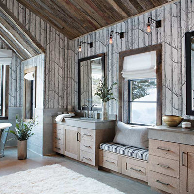 Inspiration for a rustic master freestanding bathtub remodel in Birmingham with medium tone wood cabinets, multicolored walls and an undermount sink