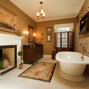 Freestanding bathtub - mid-sized traditional master beige tile and ceramic tile ceramic tile and beige floor freestanding bathtub idea in Chicago with shaker cabinets, dark wood cabinets, beige walls, an undermount sink and granite countertops