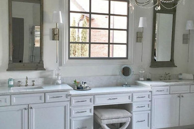 Inspiration for a large timeless master white tile bathroom remodel in Atlanta with raised-panel cabinets, white cabinets, white walls, an undermount sink and quartz countertops