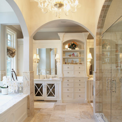 Inspiration for a timeless beige tile and limestone tile alcove shower remodel in Minneapolis with white cabinets