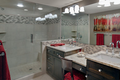 Inspiration for a mid-sized timeless master ceramic tile alcove shower remodel in Cleveland with shaker cabinets, dark wood cabinets, a two-piece toilet, gray walls, an undermount sink, granite countertops, a hinged shower door and gray countertops