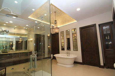 Inspiration for a medium sized traditional ensuite bathroom in Houston with glass-front cabinets, dark wood cabinets, a freestanding bath, a built-in shower, beige tiles, porcelain tiles, travertine flooring, a submerged sink, engineered stone worktops, beige floors and a hinged door.