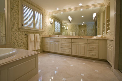 Example of a mid-sized classic master beige tile, white tile and stone tile marble floor bathroom design in Detroit with raised-panel cabinets, white cabinets, green walls, an undermount sink and marble countertops