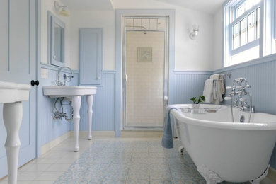 Claw-foot bathtub - farmhouse master multicolored tile claw-foot bathtub idea in Other with a console sink, shaker cabinets, blue cabinets and multicolored walls
