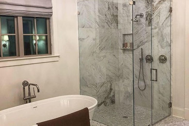 Inspiration for a large transitional master white tile and marble tile mosaic tile floor and gray floor bathroom remodel in Other with recessed-panel cabinets, gray cabinets, white walls, an undermount sink, granite countertops, a hinged shower door and beige countertops