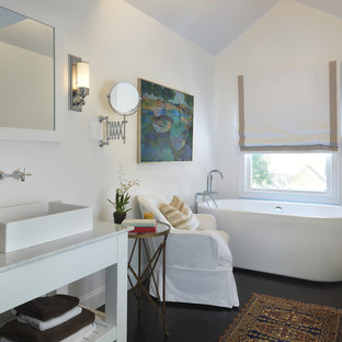 Freestanding bathtub - coastal black floor freestanding bathtub idea in Providence with a vessel sink