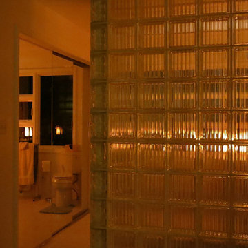 Master bathroom night lighting with a skylight and hidden lights