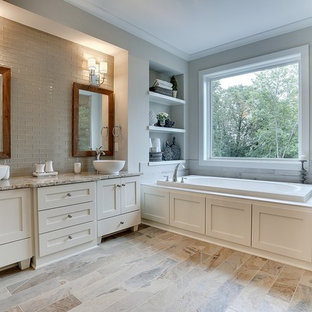Esempio di una grande stanza da bagno padronale classica con lavabo a bacinella, ante con riquadro incassato, ante bianche, top in marmo, vasca da incasso, doccia alcova, piastrelle marroni, piastrelle di vetro, pareti grigie e pavimento con piastrelle in ceramica