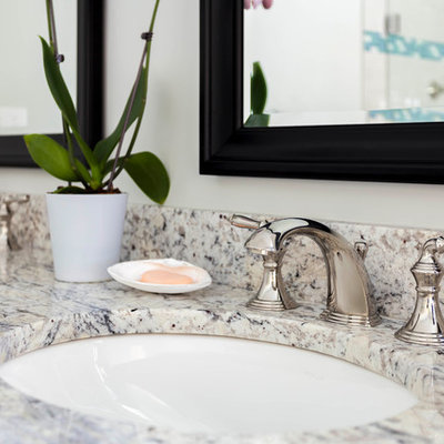 Inspiration for a large timeless master beige tile and ceramic tile ceramic tile bathroom remodel in Boston with recessed-panel cabinets, white cabinets, a one-piece toilet, green walls, an undermount sink and granite countertops