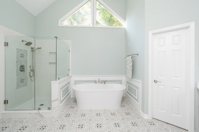 Inspiration for a large eclectic master porcelain tile freestanding bathtub remodel in Charleston with gray cabinets, green walls, an undermount sink, quartz countertops and gray countertops
