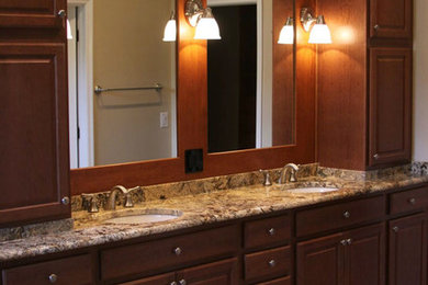 Bathroom - traditional master beige tile bathroom idea in Tampa with beaded inset cabinets, medium tone wood cabinets, beige walls and an undermount sink