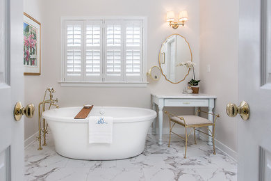 Design ideas for a medium sized classic ensuite bathroom in Richmond with shaker cabinets, turquoise cabinets, a freestanding bath, a two-piece toilet, beige walls, porcelain flooring, a submerged sink, granite worktops and white floors.