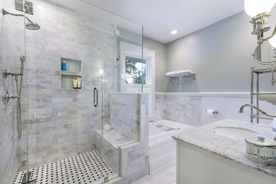 Example of a mid-sized classic master white tile and subway tile marble floor bathroom design in Cincinnati with an undermount sink, recessed-panel cabinets, white cabinets, marble countertops, a two-piece toilet and green walls