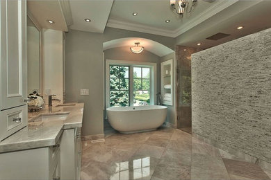 Large transitional master gray tile and stone tile marble floor bathroom photo in Toronto with an undermount sink, beaded inset cabinets, white cabinets, marble countertops, a one-piece toilet and gray walls