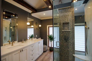 Large transitional master white tile and porcelain tile gray floor, double-sink, wood-look tile floor and exposed beam shower bench photo in New York with white cabinets, gray walls, an undermount sink, quartz countertops, a hinged shower door, white countertops, a built-in vanity, recessed-panel cabinets and a niche