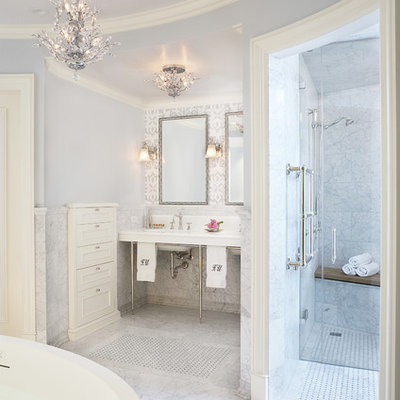Freestanding bathtub - traditional freestanding bathtub idea in Chicago with a console sink