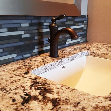 Master bathroom tile backsplash with granite countertop