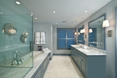 Example of a mid-sized trendy master white tile white floor corner shower design in Philadelphia with an undermount tub, marble countertops, an undermount sink, gray walls, a hinged shower door, raised-panel cabinets and gray cabinets