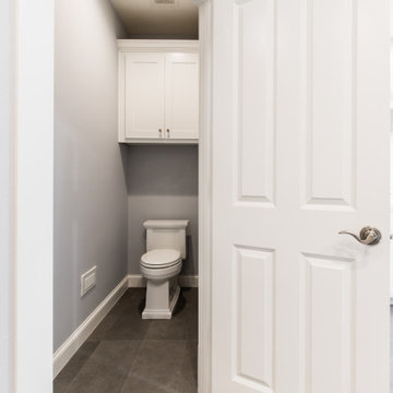 Master Bathroom Toilet Room with Custom Renowned Cabinets