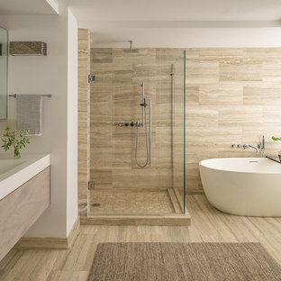 Example of a large minimalist master bathroom design in Boston with flat-panel cabinets, light wood cabinets, brown walls, a wall-mount sink, quartz countertops, a hinged shower door, white countertops and a floating vanity