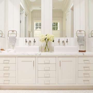 Master bathroom, white vanity with two sinks and large mirrors