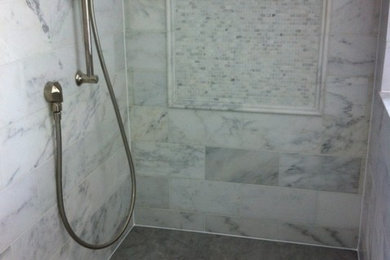 Example of a mid-sized urban master alcove shower design in Chicago with gray walls