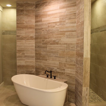 Master bathroom with accent wall behind tub