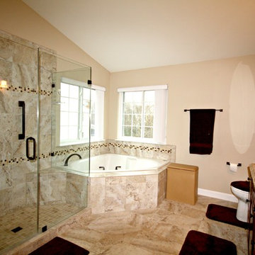 Master Bathroom with Frameless Shower and Jetted Tub