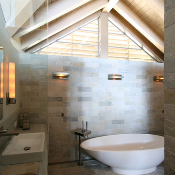 Master bathroom with full height natural stone walls in running bond