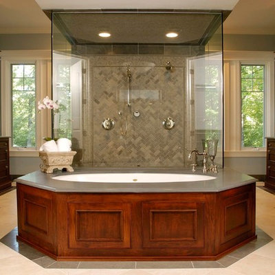 Double shower - huge traditional master beige tile and limestone tile limestone floor double shower idea in Chicago with recessed-panel cabinets, dark wood cabinets, an undermount tub, blue walls, an undermount sink, limestone countertops and gray countertops