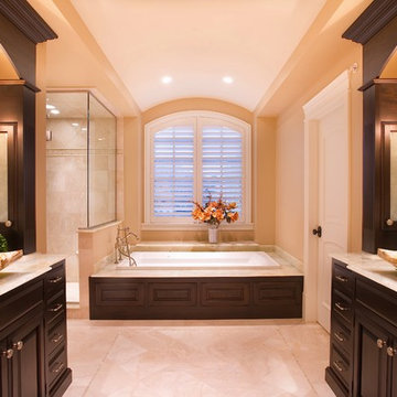 Master Bathroom with Platform Tub, Vessel Sinks and Stained Wood Cabinetry
