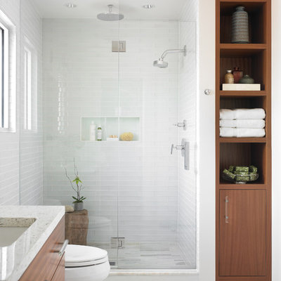 Mid-sized minimalist master white tile and glass tile marble floor bathroom photo in Atlanta with an undermount sink, flat-panel cabinets, medium tone wood cabinets and white walls