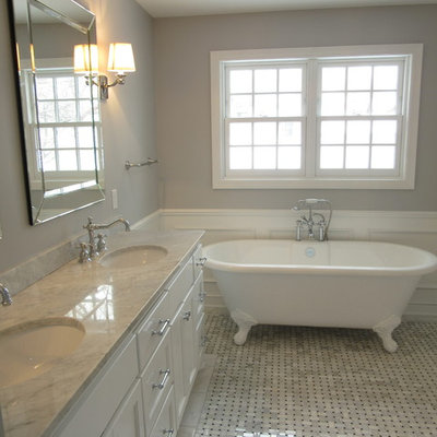 Bathroom - large traditional master gray tile and stone tile marble floor bathroom idea in Minneapolis with shaker cabinets, white cabinets, a two-piece toilet, gray walls, an undermount sink and marble countertops