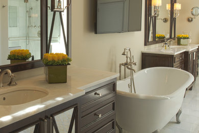 Large country master porcelain tile bathroom photo in New York with recessed-panel cabinets, dark wood cabinets, a one-piece toilet, beige walls, an undermount sink and marble countertops