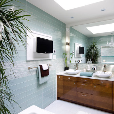 Example of a trendy blue tile and glass tile bathroom design in Toronto with a vessel sink
